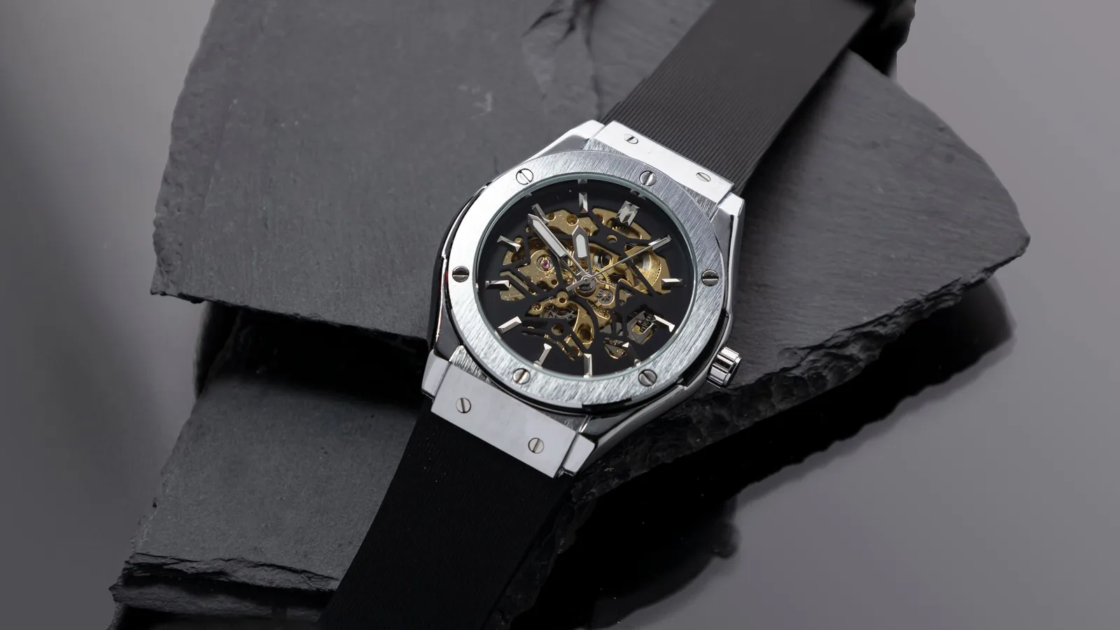 The movement of a watch visible through a skeletonised dial