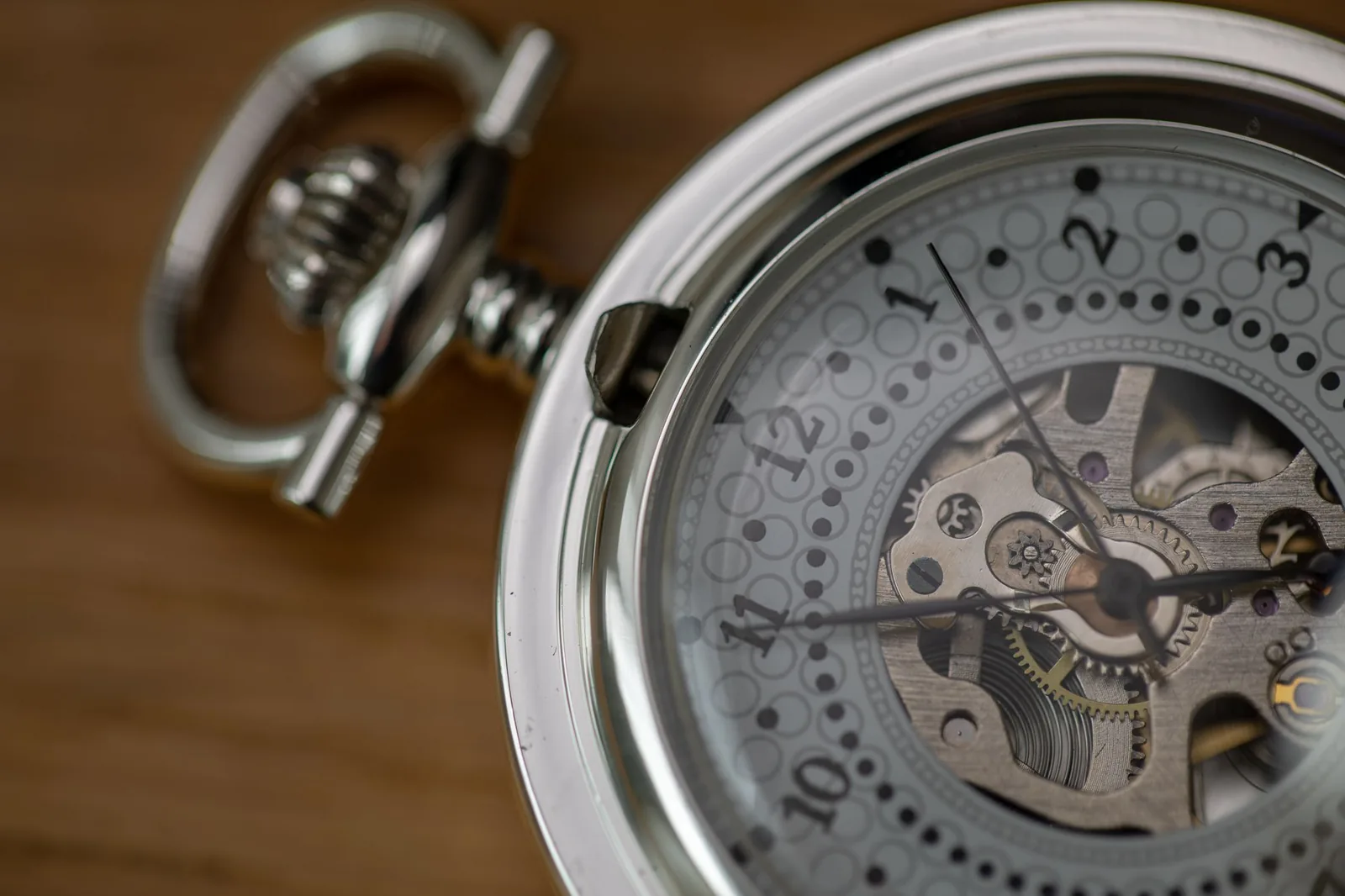 The plate and wheels of a hand-wound watch movement seen at high magnification