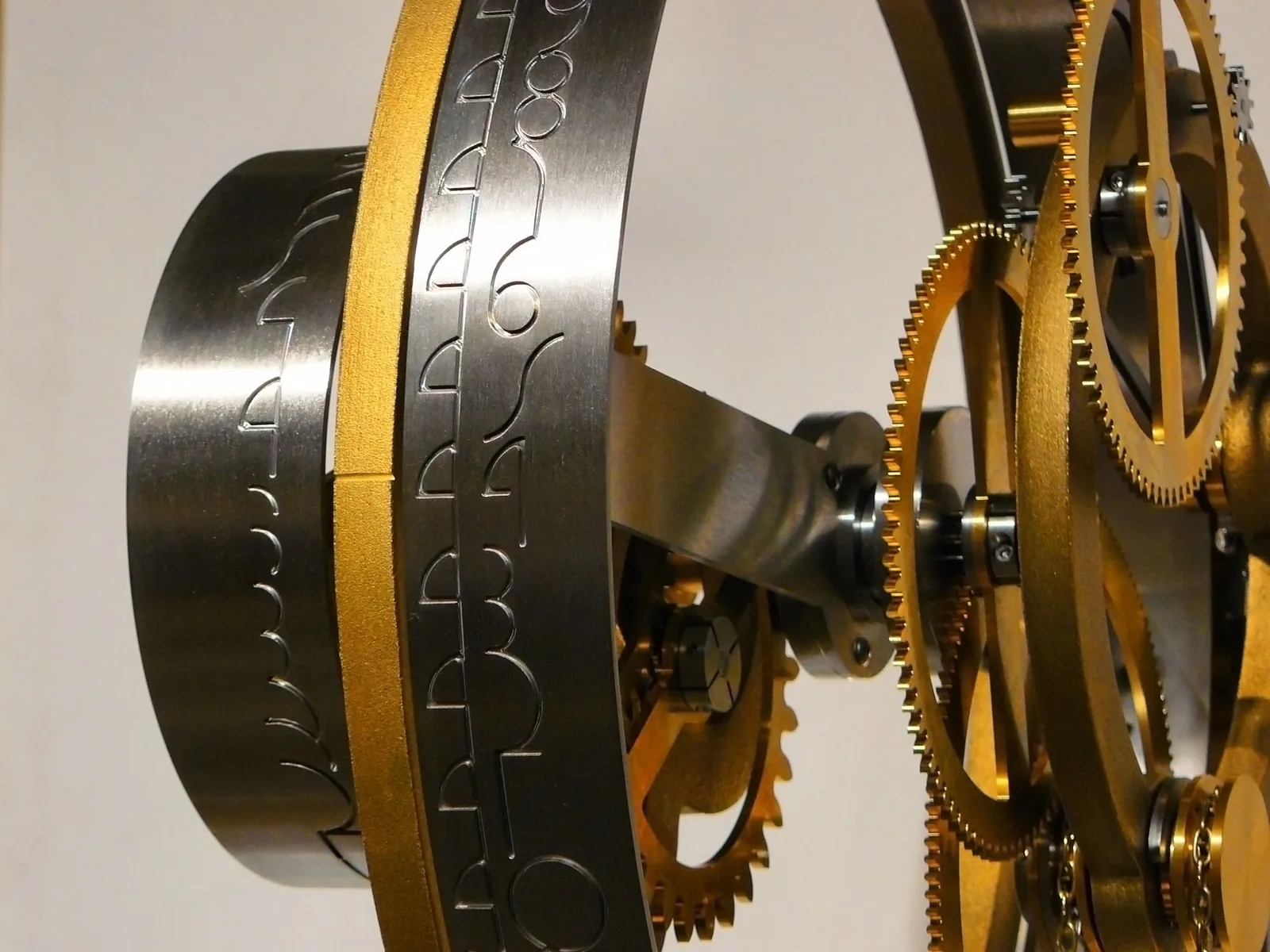 A complex brass gear mechanism seen close up