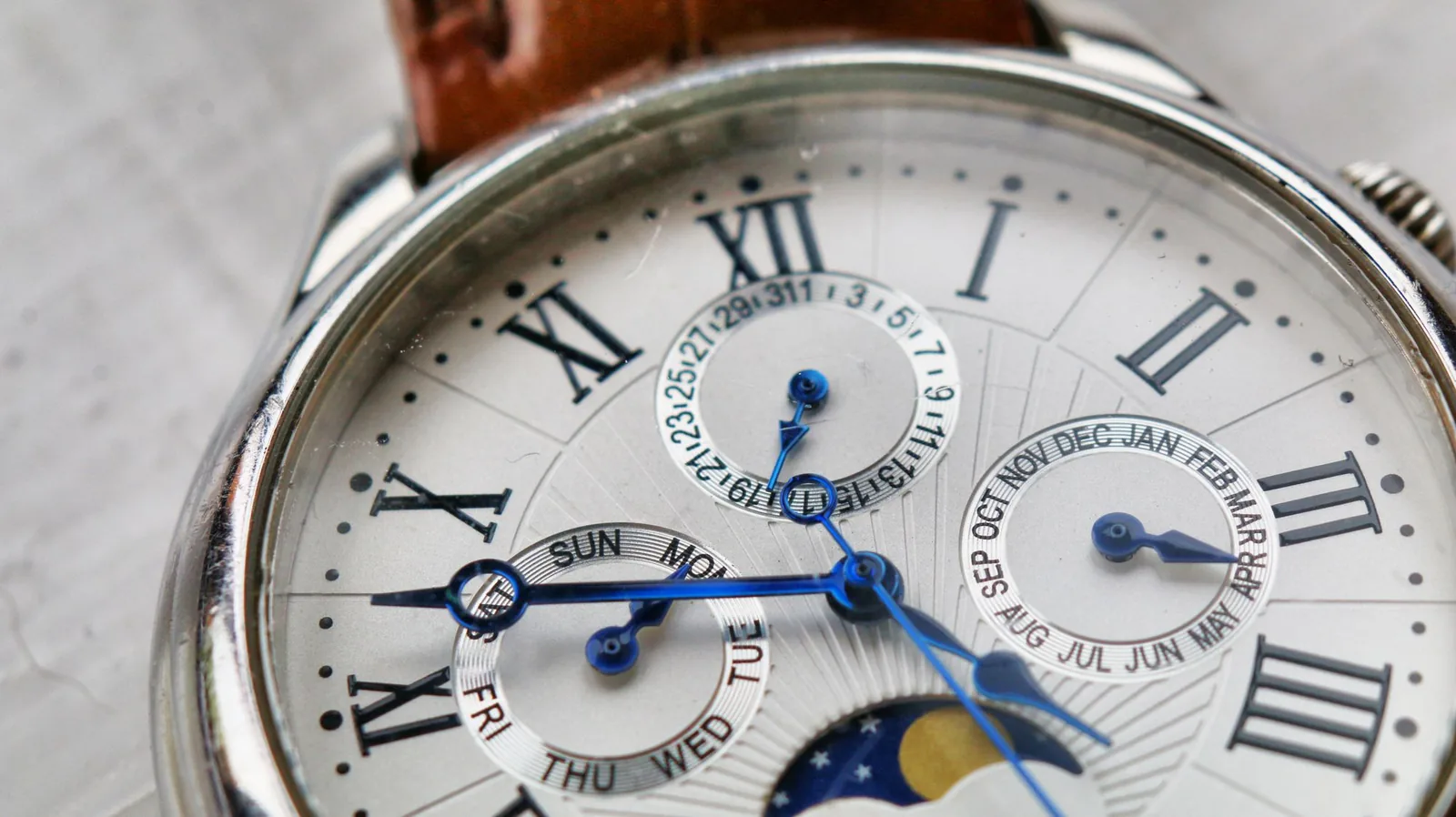 The printed markings and subdials of a watch face