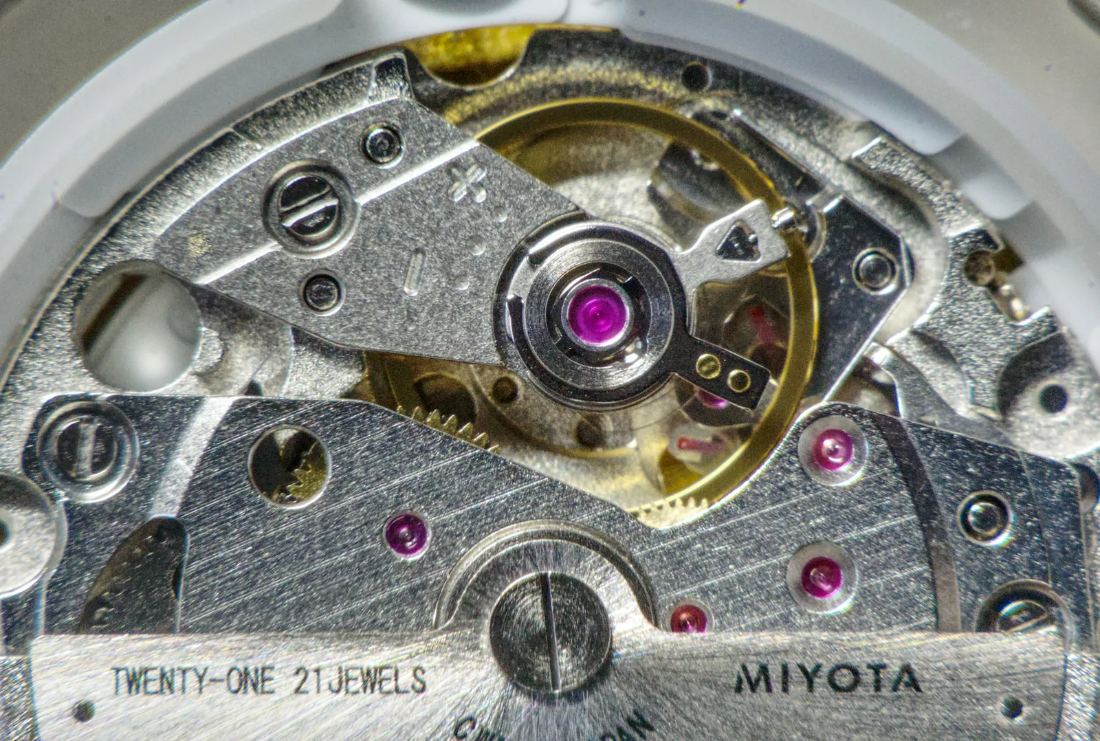 The circuit and coil of a quartz watch movement seen close up