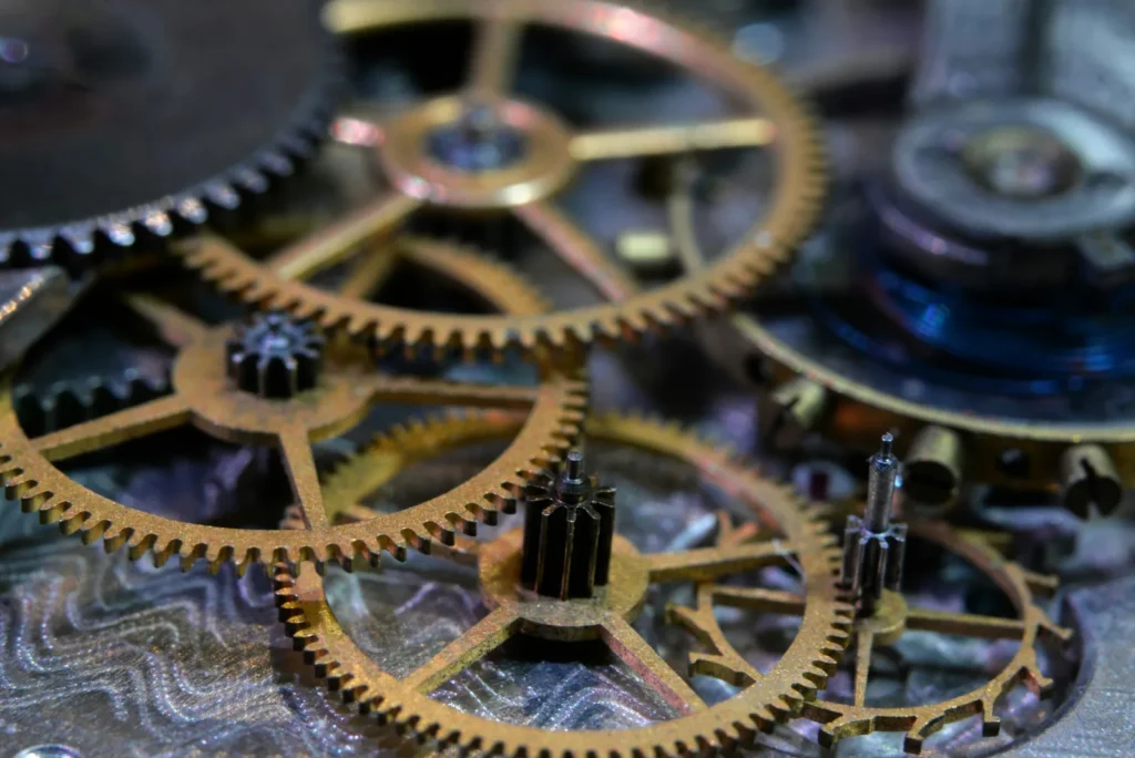 A watch balance wheel and hairspring seen at high magnification