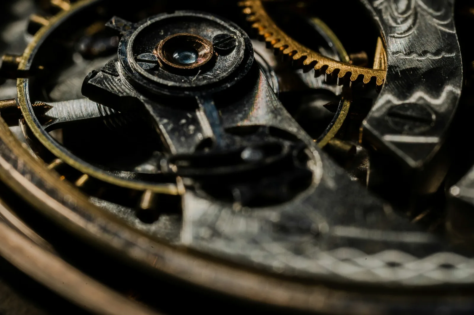 Engraved lettering on a watch movement bridge seen at high magnification