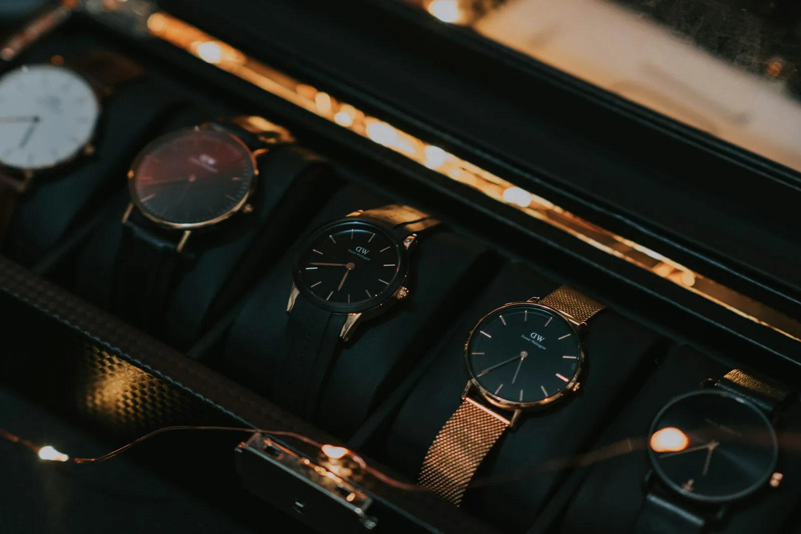 Several watches lying together in a drawer