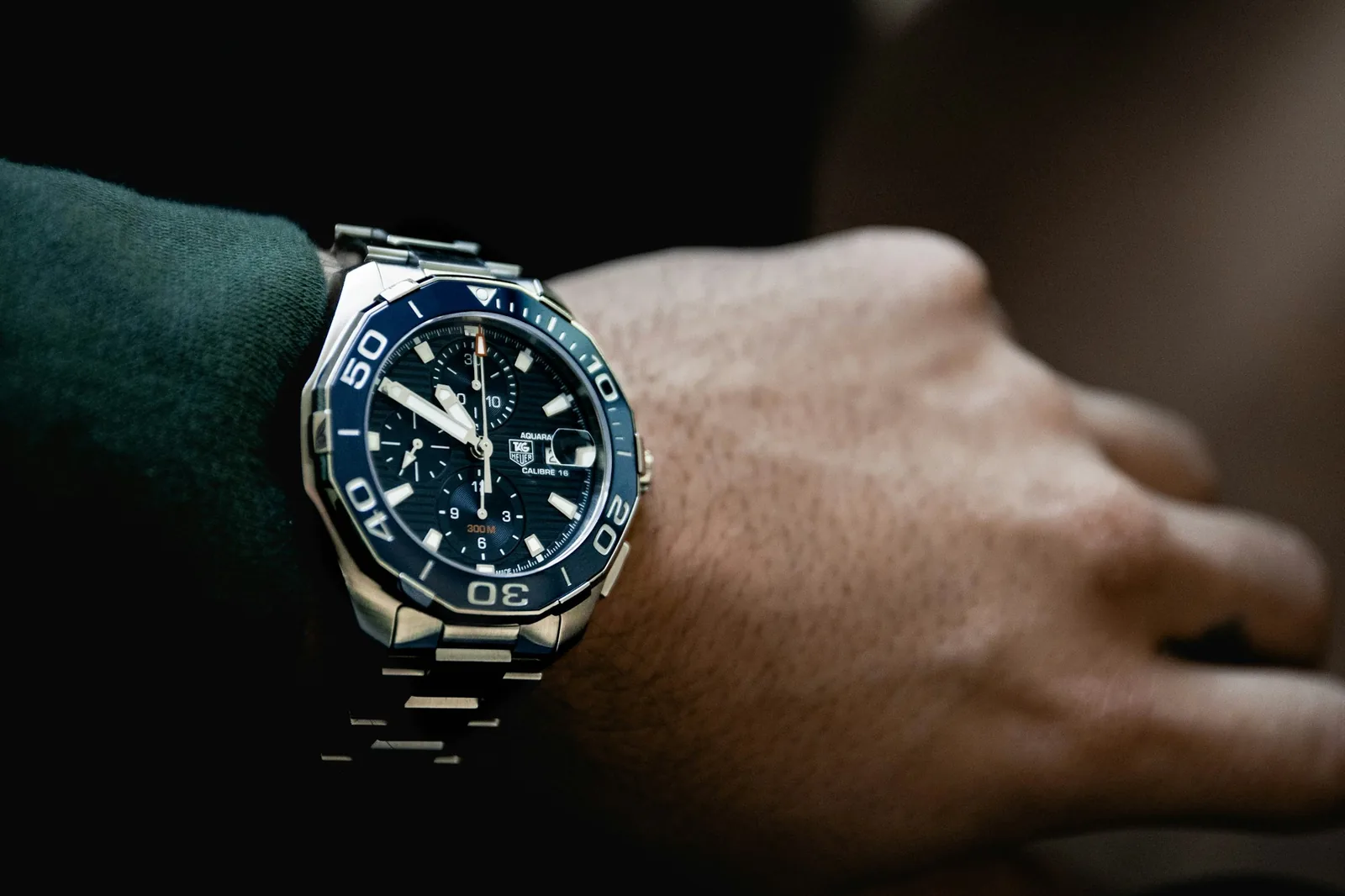 A wristwatch worn on a wrist in daylight seen close up