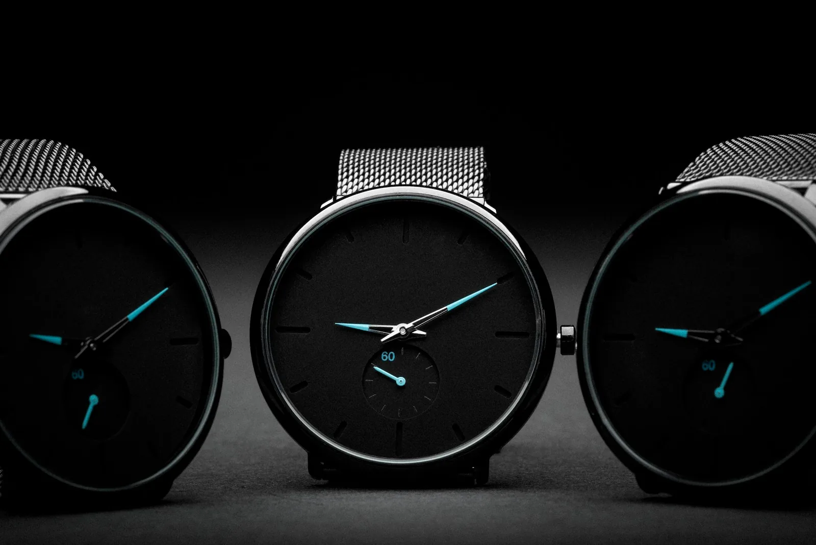 Three watches of different sizes in a row
