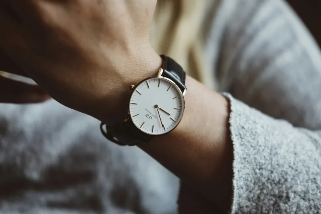 A plain wristwatch worn on a wrist