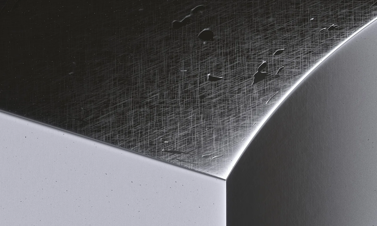 The junction between a brushed and a polished steel surface on a watch case