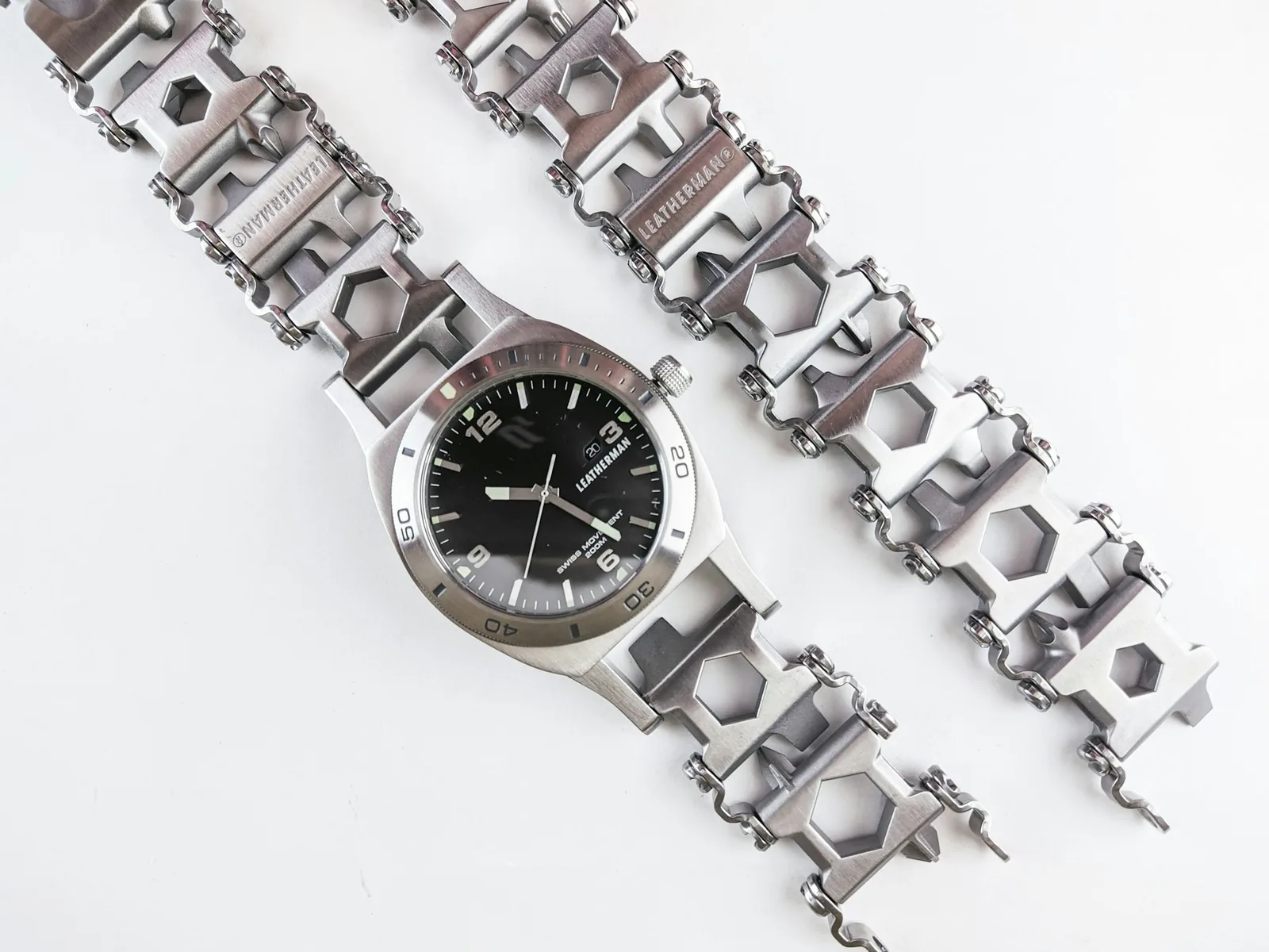 A matte-finished titanium bracelet photographed close up, showing its grey surface