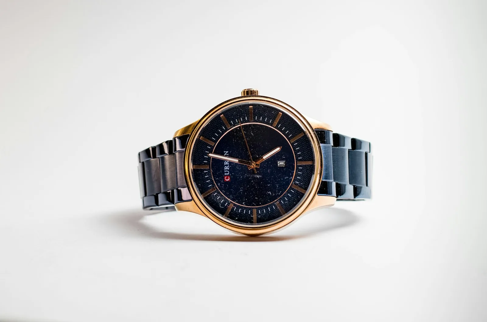 Sunlight falling across the dial of a solar-powered watch, showing the textured surface under the markers