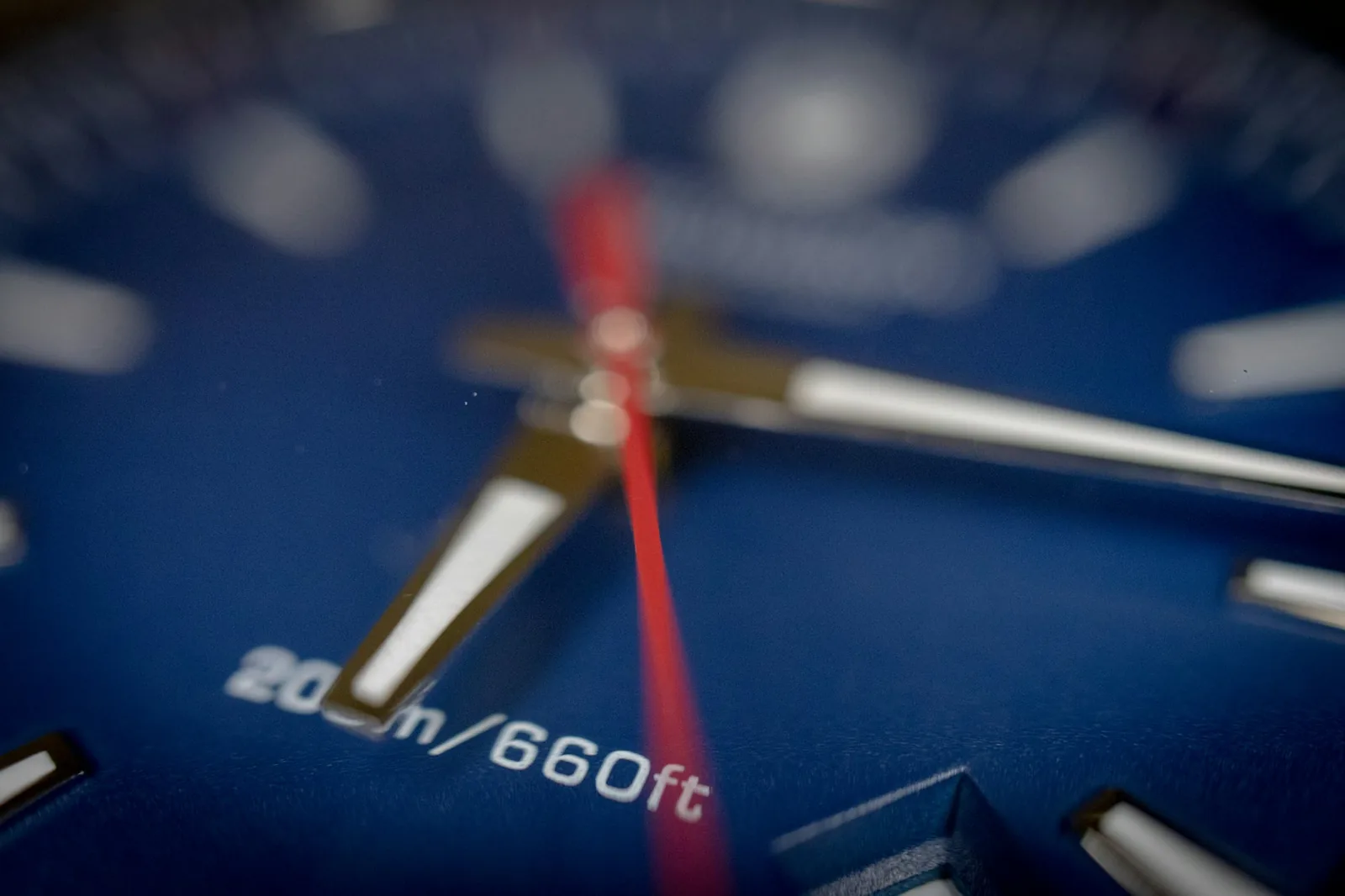 Extreme close-up of a watch escapement showing the pallet fork and escape wheel teeth