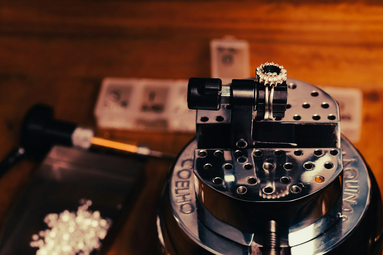 Disassembled watch movement parts arranged in a small cleaning tray