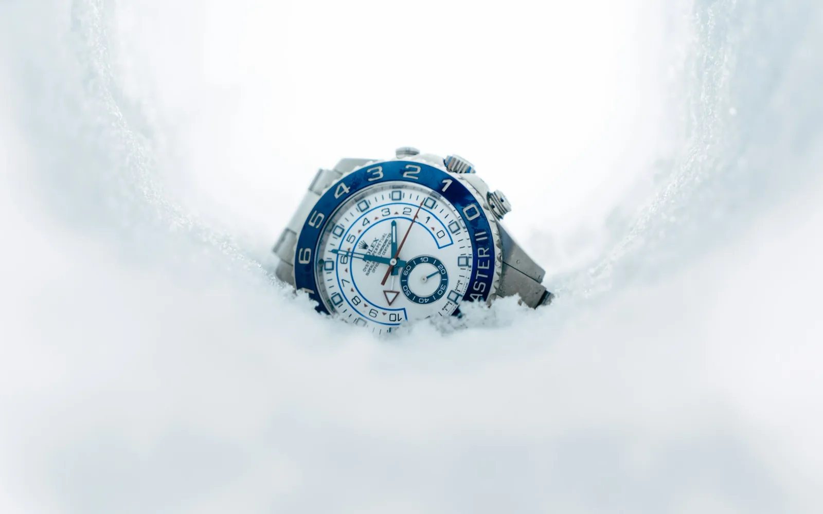 Condensation forming on the inside of a watch crystal, obscuring part of the dial