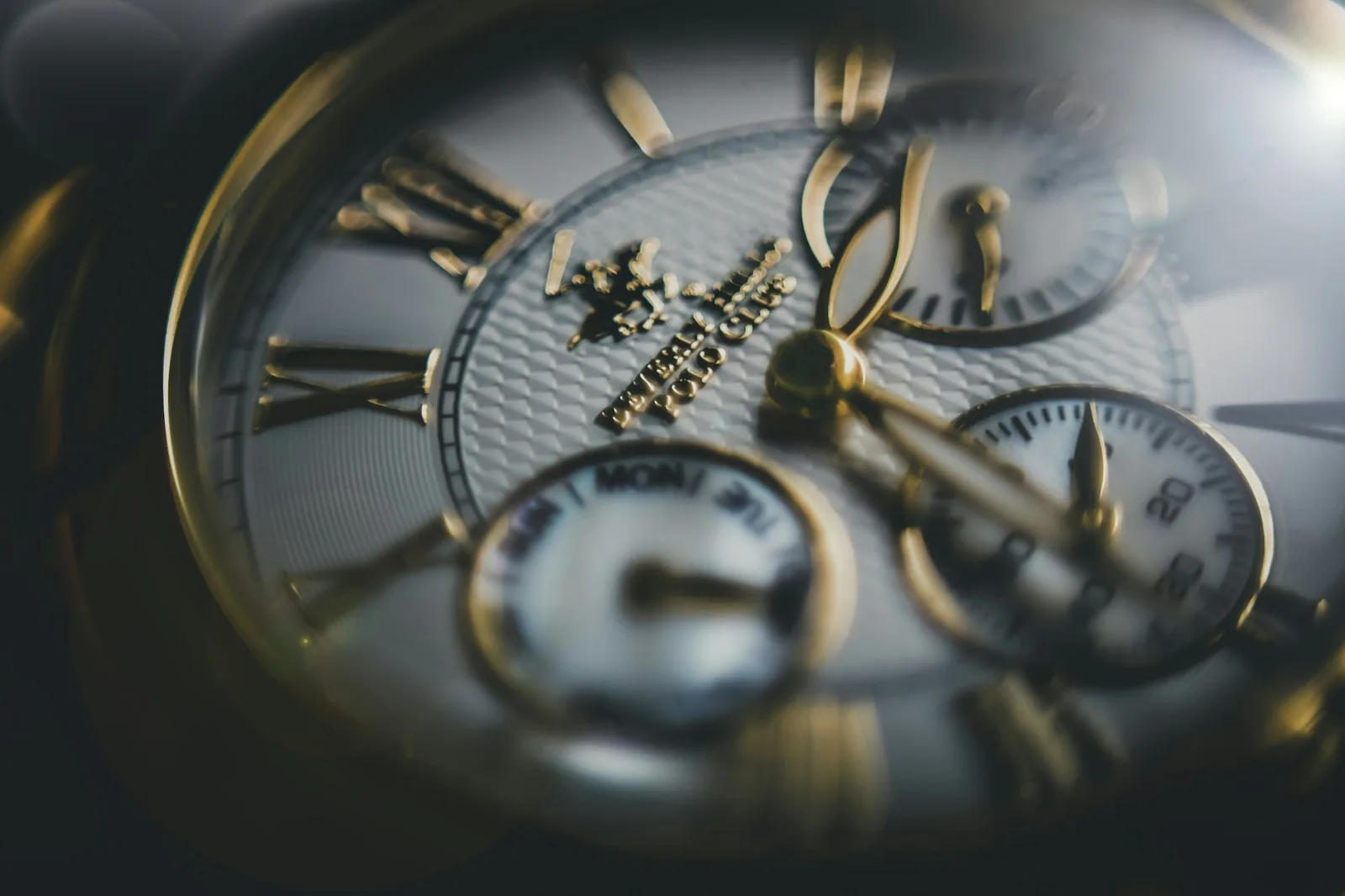The date window of a watch dial photographed close up, showing the printed numeral