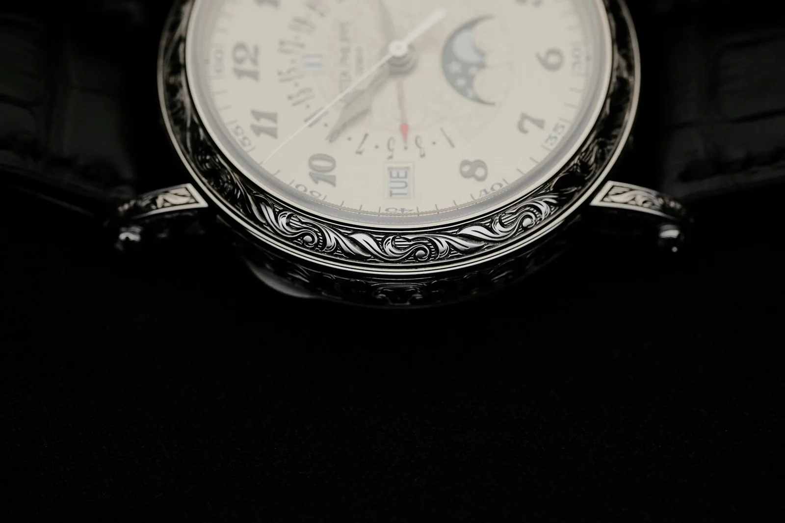 The engraved case back of a wristwatch showing water resistance markings and serial text