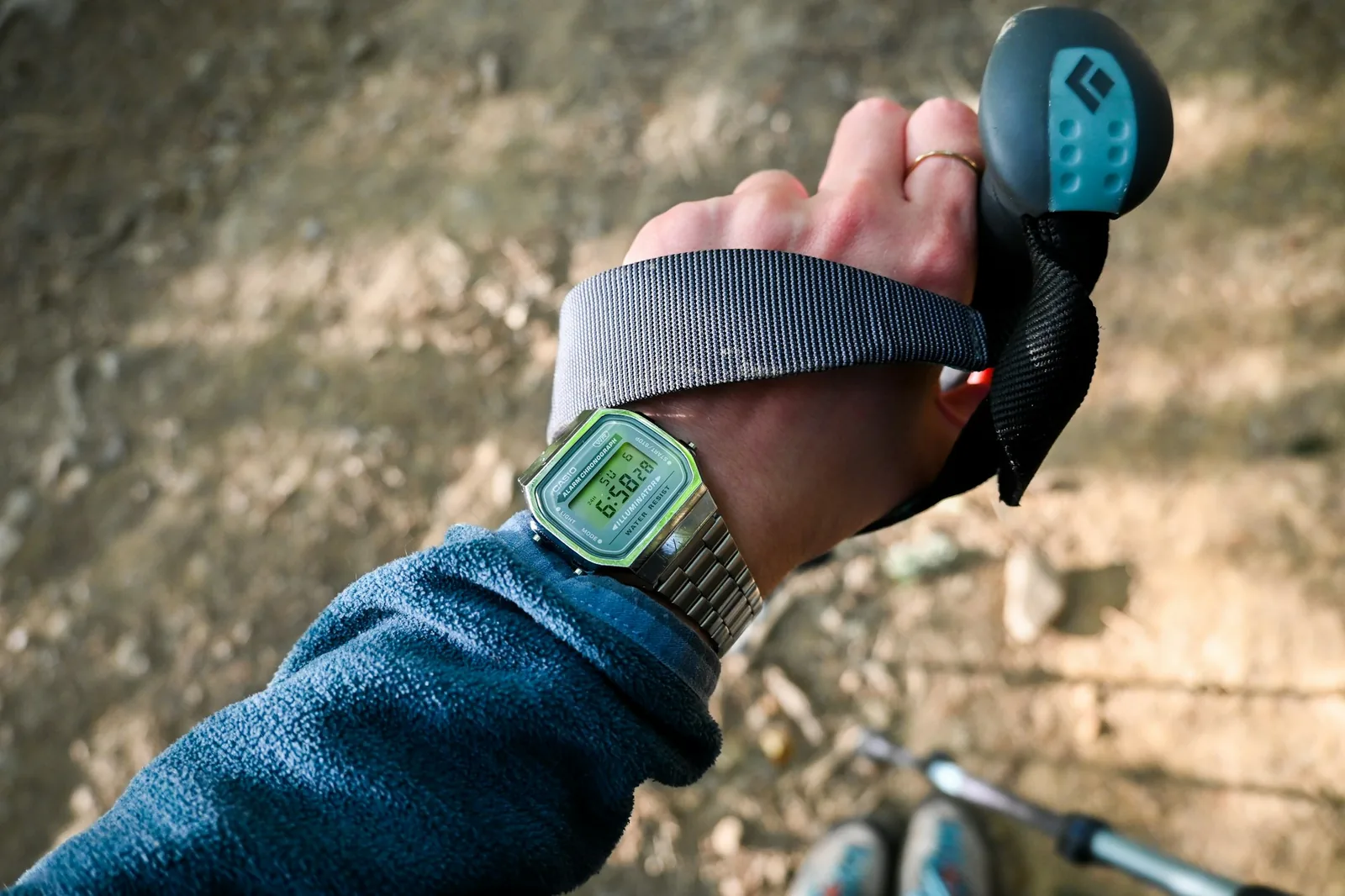 A wristwatch worn outdoors in cold weather against a frosted background