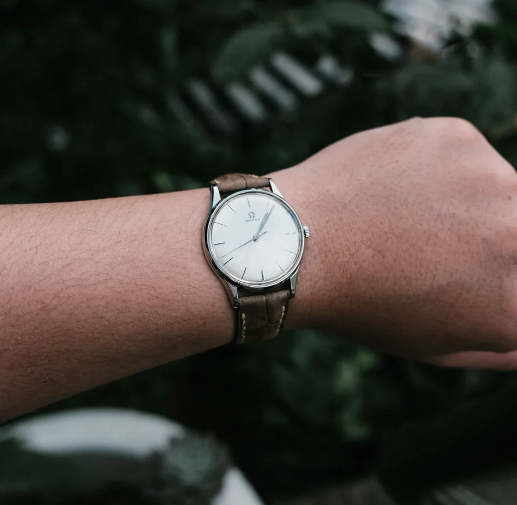 A modestly sized wristwatch worn on a slim wrist, seen from above