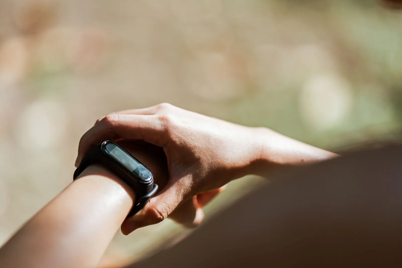 A modestly sized wristwatch worn on a slim wrist, seen from above