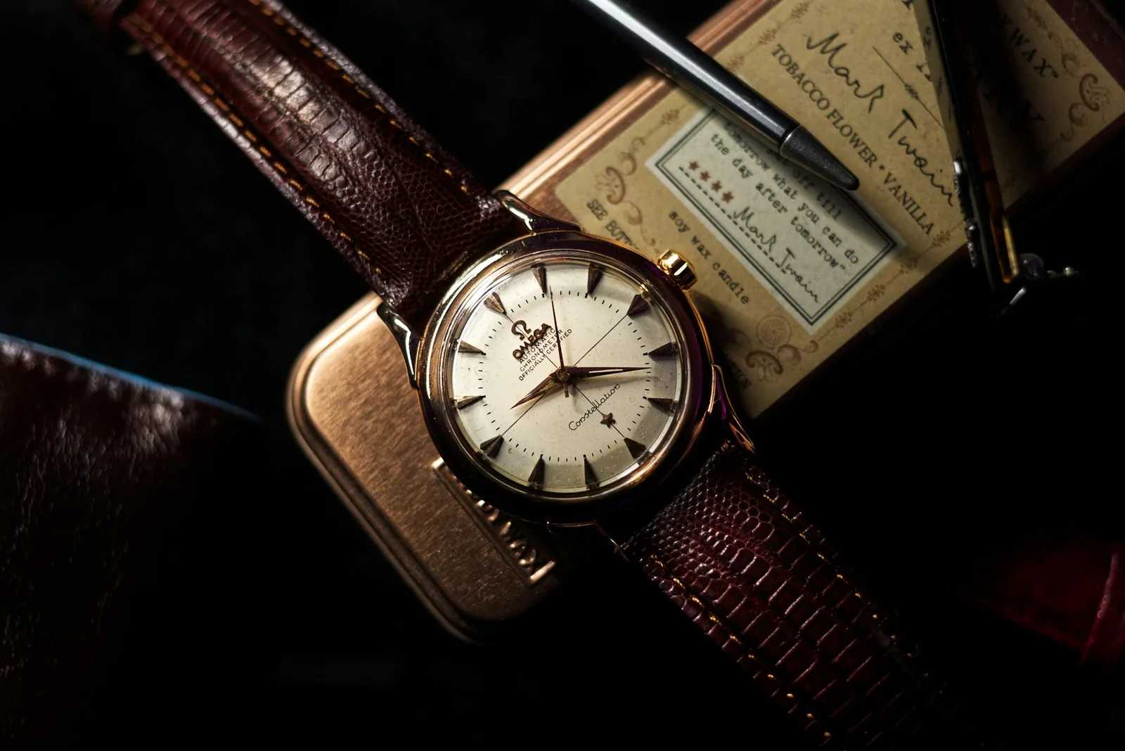 A small vintage wristwatch with a simple dial and slim case