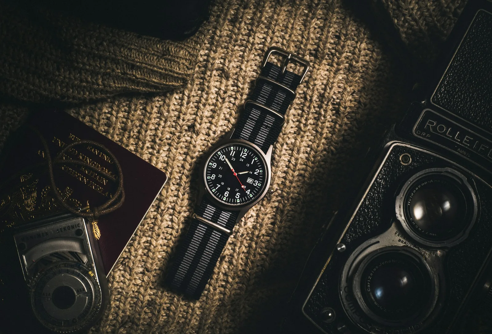 A tapered leather watch strap laid flat, narrowing towards the buckle