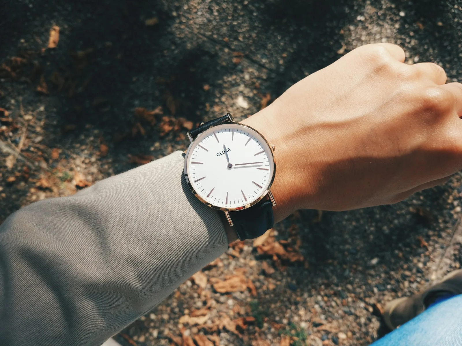A slim wristwatch worn on a narrow wrist, seen from above